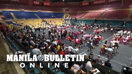 Pasay City residents receive their cash aid from the DSWD at the Cuneta Astrodome