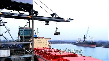 Ship unloading and retrieval with the help of crane at Paradeep Port