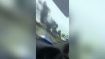 Passenger videos scrap yard in flames
