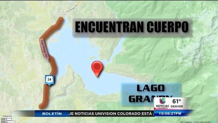 Dan con el cuerpo del hombre que se cayó en el lago