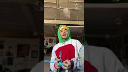 Man Tests Helium Blown Bubbles