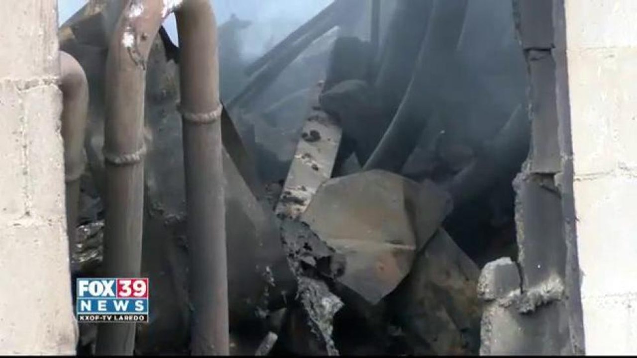 Shoe warehouse continues to burn after nearly two weeks