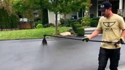 How a professional repairs cracks in a driveway