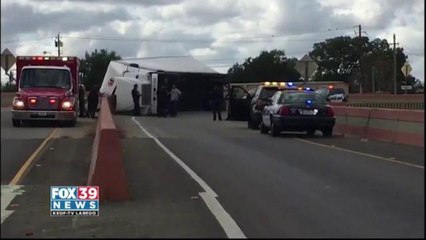 Drivers stuck in traffic after 18-wheeler roll over.