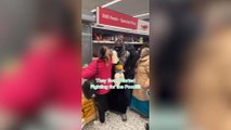 This bizarre footage shows the moment a scuffle erupted at an Asda supermarket - in a row over reduced items