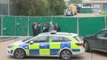 Detectives at the scene in Grays after 39 bodies were found in a container