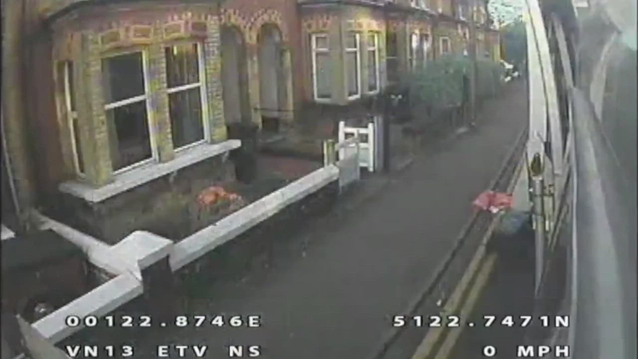 CCTV of a van driving on a pavement to overtake a bin lorry