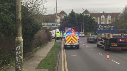 Van hangs over bridge