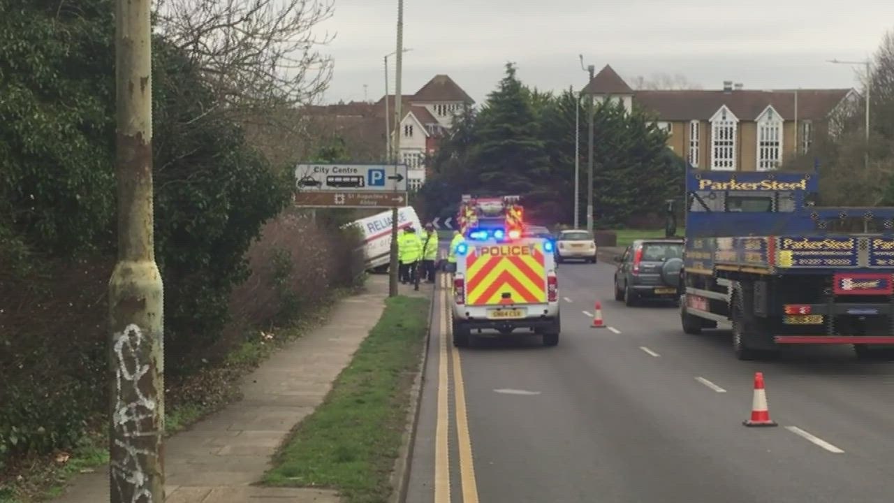 Van hangs over bridge