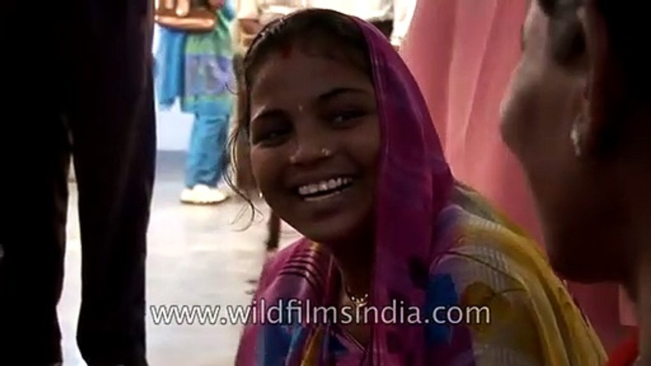 Weaving colorful cloth patterns on a Hand-loom in Uttar Pradesh, India