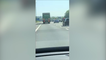 Passenger hangs out of window on M20