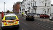 Emergency services at Deal flats amid reports a woman's died