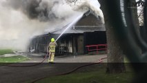 Firefighters are tackling a fire at a sports pavilion