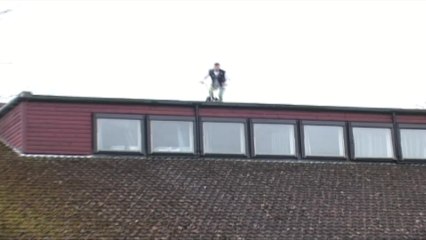 Biker jumps off roof