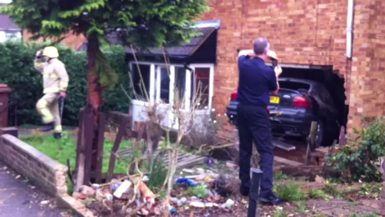 Car crashes into living room