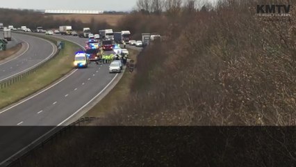 Car flips in crash on busy road