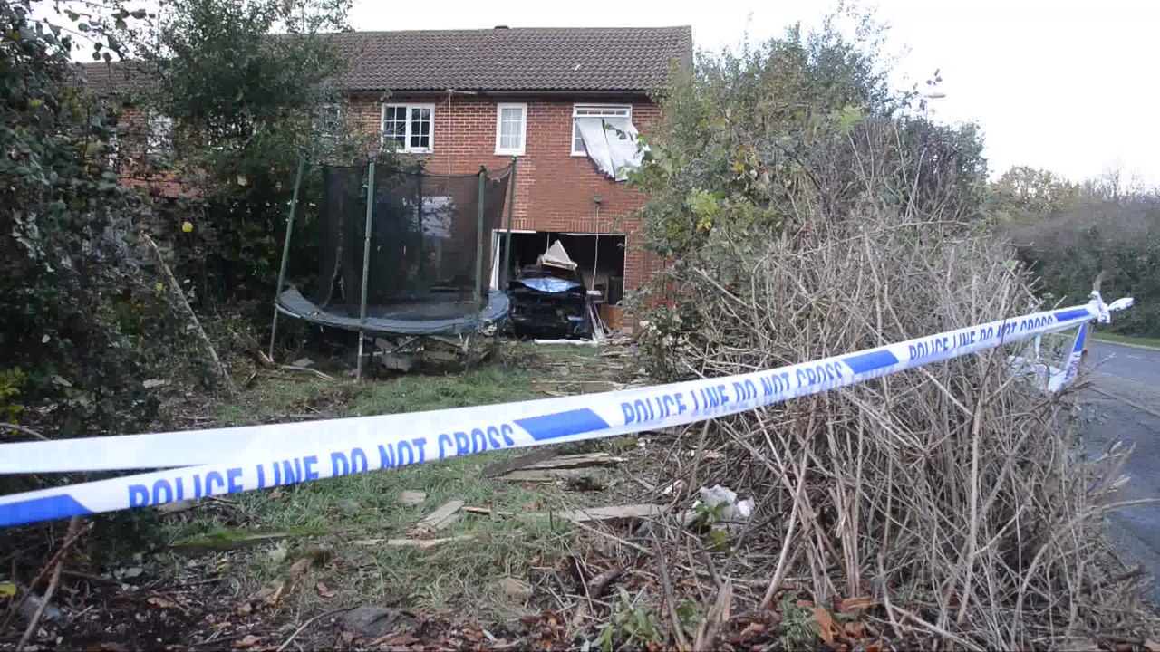 Car smashes into living room