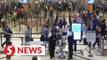 Chaos at Atlanta airport after felon's gun goes off