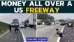 US: Commuters stop on Southern California freeway to pick wads of cash lying on road | Oneindia News