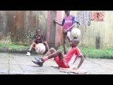 Boy Shows Impressive Skill While Juggling One Football With Feet While Balancing Another On Head