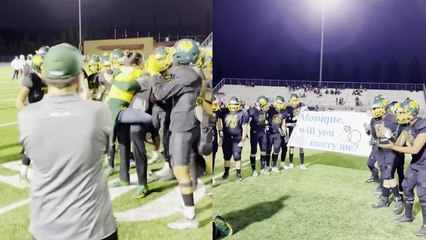 'Team erupts in cheers as their football coach surprises his girlfriend with a marriage proposal '