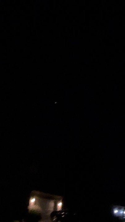 Debris Falling Through the Night Sky