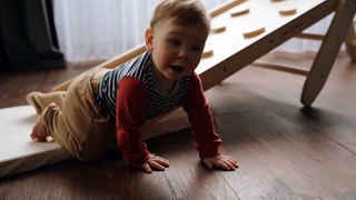 A Little Boy Crawling on the Floor