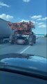 Motorist Drives From Underneath Tractor While Driving on the Highway