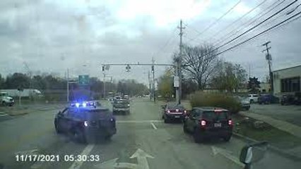 Car Squeezes Through Traffic During Police Chase