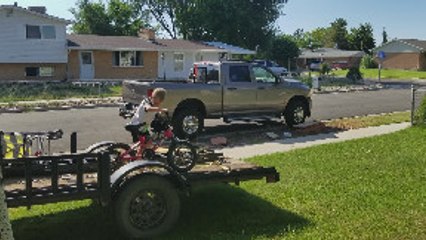 Son Jumping Bike off Trailer Faceplants