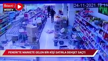 Pendik'te markete gelen bir kişi satırla dehşet saçtı