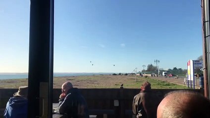 Helicopters pictured carrying out a flypast of Portsmouth