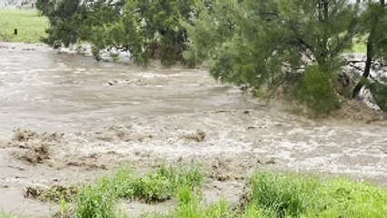 Backyard Becomes Raging Torrent During Flood Event