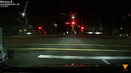 Cars racing on through red light. 11.21.2021 — SACRAMENTO, CA