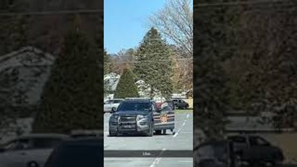 Woman Seen Getting into Driver's Seat of Law Enforcement Vehicle