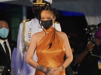 Rihanna Went Braless in a Burnt Orange Silk Halter Gown