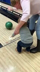 Toddler and Grandma Take a Tumble While Bowling
