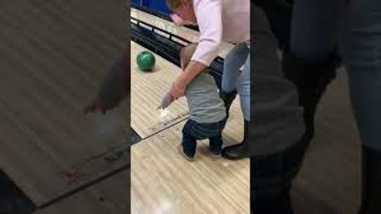 Toddler and Grandma Take a Tumble While Bowling