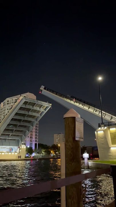 Man Climbs Up Open Drawbridge