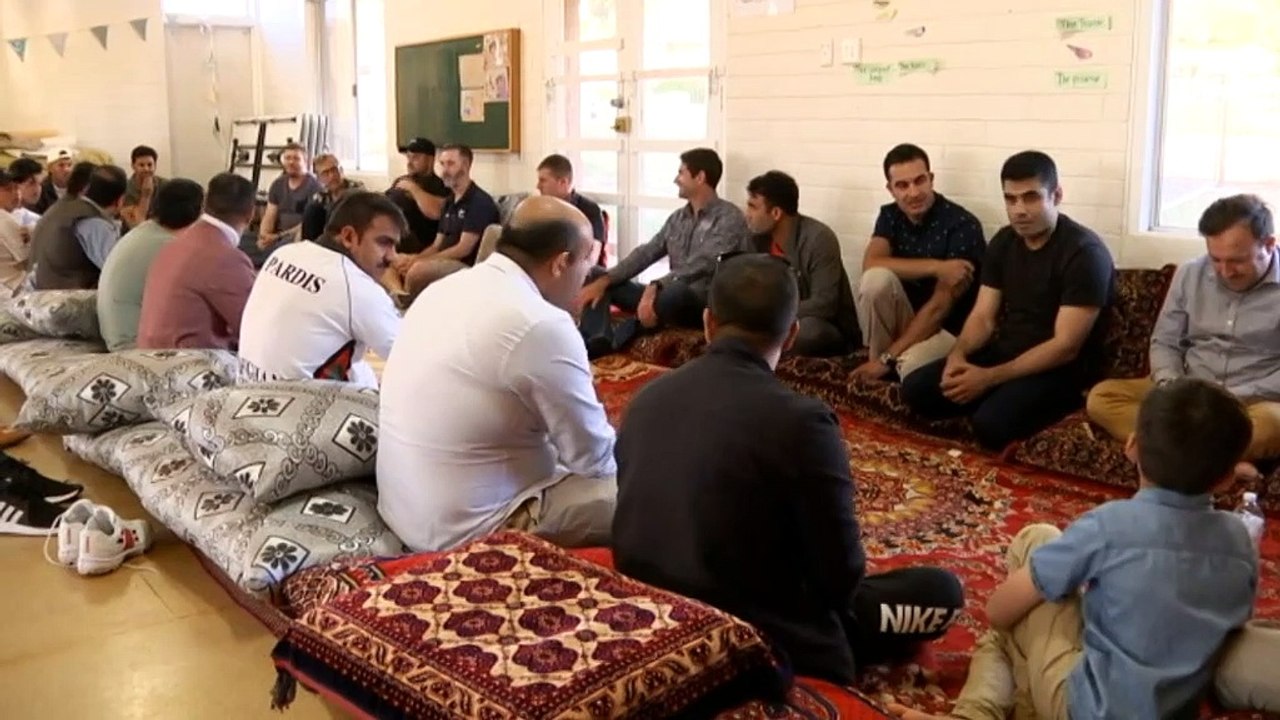 Afghan interpreters and troops come together over a game of cricket