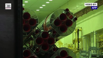 Space rocket to carry Japanese billionaire to ISS taken to launchpad