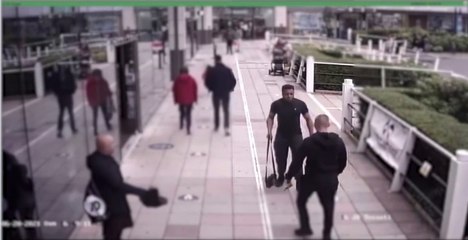 Thug caught on CCTV attacking man with two hammers