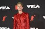 What is one thing machine Gun Kelly refuses to wear?