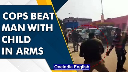 UP: Cops thrash man carrying child, police admits 'insensitivity' | Oneindia News