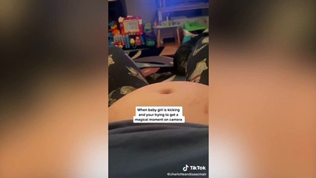 BUMP SHUFFLE - This is the hilarious moment a dog scoots on his bum while a mum-to-be tries to film her baby bump kicking