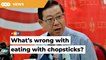 Since when did eating with chopsticks make anyone less Malaysian, Guan Eng asks Dr M