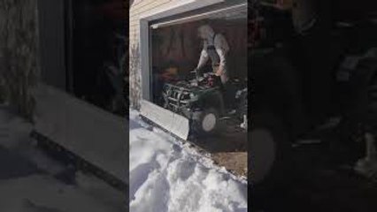 Guy Hits His Head on Garage Door