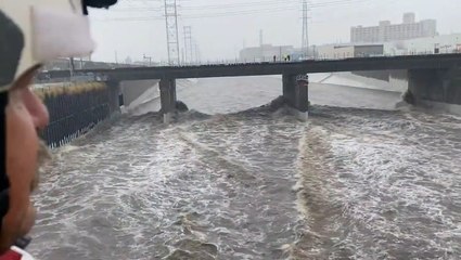 Vehicles stranded in the LA River amid heavy rainfall