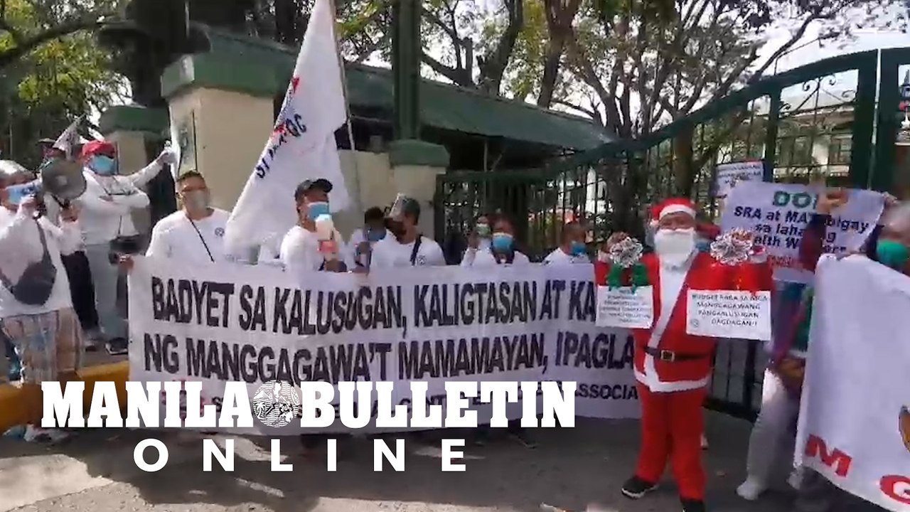 Hospital workers conduct Christmas carol protests in front of the gates of DOH