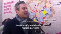 Afghan artists who fled Taliban paint mural to say 'Thank you, Albania!'
